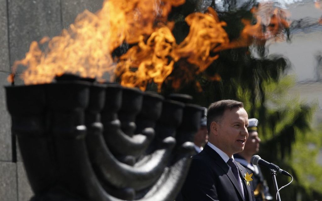 Poland's President Andrzej Duda speaks during state ceremonies in homage to the victims and fighters of the 1943 Warsaw Ghetto Uprising, on the 75th anniversary of the start of the revolt, in front of the Monument to the Warsaw Ghetto Heroes, in Warsaw, Poland,  (AP Photo/Czarek Sokolowski)