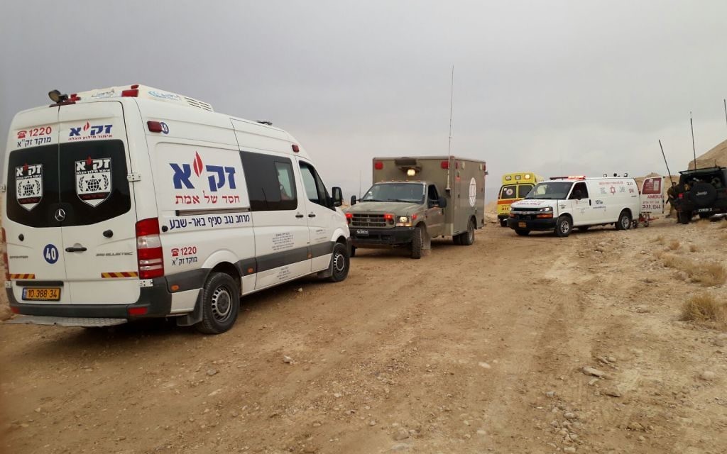 Rescue volunteers from the ZAKA Divers Unit assisting the operation to recover missing persons . 


Images Credit ZAKA