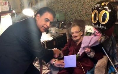 Shokat Ali surprised long-time Labour activist Edith Poulson with flowers and a special card to accompany her traditional greeting from The Queen.