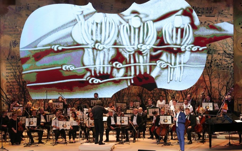 Francesco Lotoro conducts the Ashdod Symphony Orchestra and children from the Bikurim Performing Arts School in Eshkol and the Yerucham Conservatory. (Picture: Oded Antman/JNF UK)