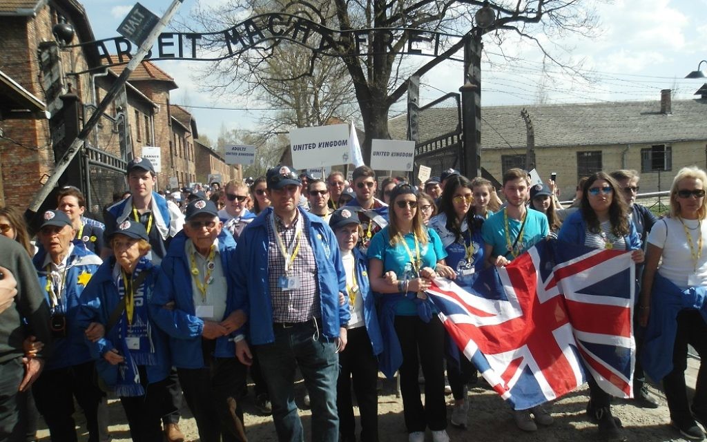 The UK Delegation walk through the entrance gate at Auschwitz during Thursday's March of the Living