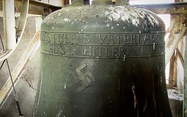 A swastika emblazoned on a bell in a church in the German town of Schweringen. (Screen capture/YouTube)