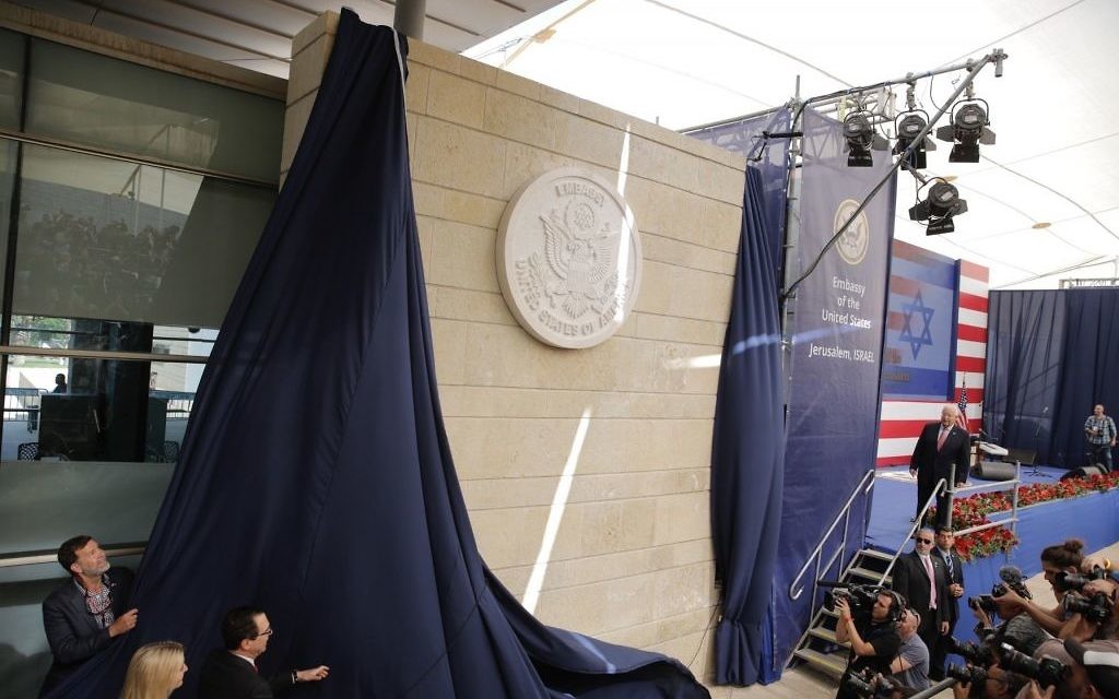 U.S. President Donald Trump's daughter Ivanka Trump, left, and U.S. Treasury Secretary Steve Mnuchin unveil an inauguration plaque during the opening ceremony of the new US embassy in Jerusalem, Monday, May 14, 2018.  . (AP Photo/Sebastian Scheiner)