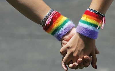 An image of rainbow sweat bands, evoking the LGBT pride flag