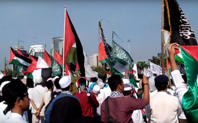 Palestinian, Indonesian and Islamist flags laden a protest in Jakarta 2018