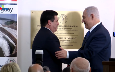 Benjamin Netanyahu embraces former Paraguay President Horacio Cartes after unveiling a plaque at an embassy dedication in Israel in 2018.