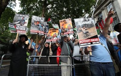 Pro-Palestinian demonstrators outside the Embassy of Saudi Arabia, London, during an Al-Quds Day march in support of Palestinians. PRESS ASSOCIATION Photo. Picture date: Sunday June 10, 2018. See PA story PROTEST Flags. Photo credit should read: Yui Mok/PA Wire