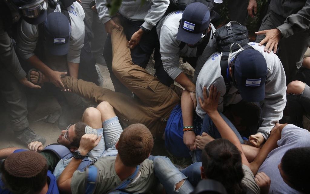 Israeli police evict Jewish settlers at the West Bank settlement of Netiv Avot