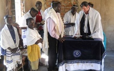 Local and foreign Rabbis pray in the synagogue of Puti next to Mbale