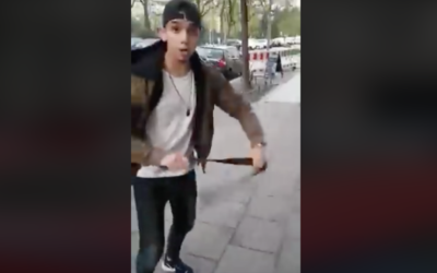 A screenshot from the Facebook video that went viral - of the 19-year-old Syrian assaulting a man wearing a kippah in Berlin. (Screenshot from Facebook)