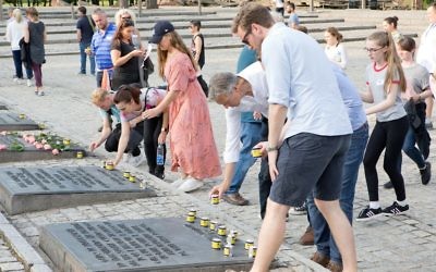 The group concluded their trip to Auschwitz by lighting memorial candles