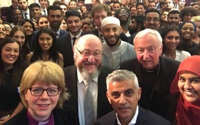 London Mayor Sadiq Khan and the Chief Rabbi pose for an Interfaith iftar selfie, with other faith leaders and students (2018)