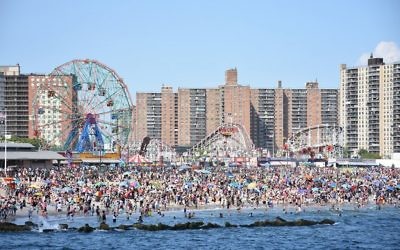 Coney Island beach, amusement parks, and high rises as seen from the pier in June 2016