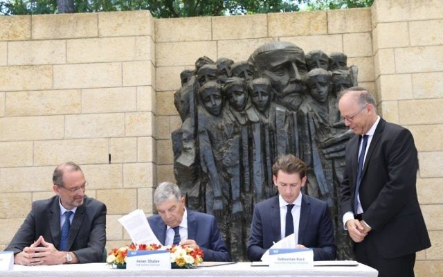 Sebastian Kurz and Yad Vashem's chair Avner Shalev signing the historic agreement. 

Credit: @yadvashem on Twittr