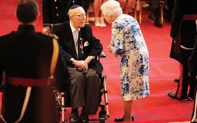 Lieutenant Colonel Mordaunt Cohen receiving his MBE from the Queen