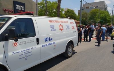 Emergency ambulance from Magen David Adom arrives at the seen of a stabbing
