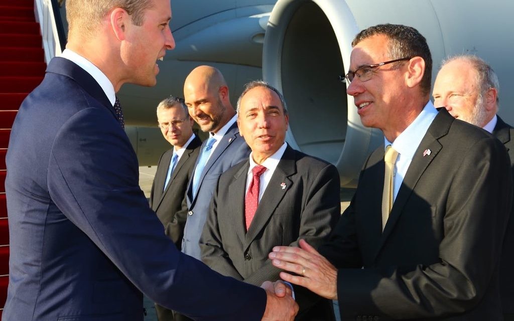 Israel's envoy to the UK Mark Regev greets Prince William at Ben Gurion