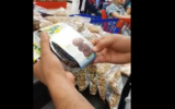 Screenshot of video, where activist removes Israeli dates from Carrefour supermarket