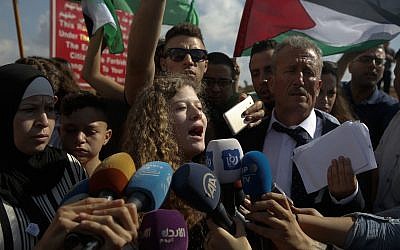 Ahed Tamimi speaks to the media after she was released by the Israel army in her village of Nebi Saleh in the West Bank  (AP Photo/Nasser Shiyoukhi)
