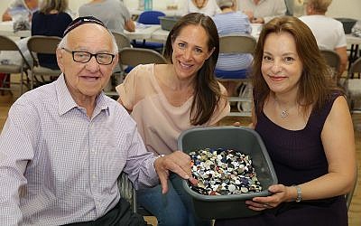 Zigi Shipper, Gabi Rolfe and Abigail Mann at the Bushey United Synagogue button count earlier this month