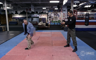 A screenshot from the episode in which Sacha Baron Cohen gets Georgia state representative Jason Spencer to drop his trousers and attack him with his backside.
