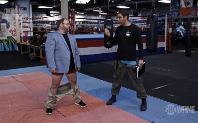 A screenshot from the episode of This Is America, in which Sacha Baron Cohen gets Georgia state representative Jason Spencer to drop his trousers and attack him with his backside.