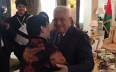 Diego Maradona embraces Palestinian Authority President Mahmoud Abbas