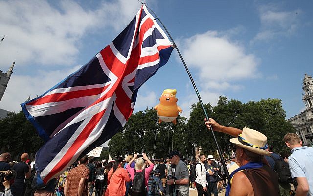 A 'Baby Trump' balloon rises after being inflated in London's Parliament Square, as part of the protests against the visit of US President Donald Trump to the UK.