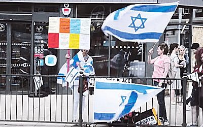 Pro Israel activists demonstrate outside the Co-Operative in Hampstead Garden Suburb