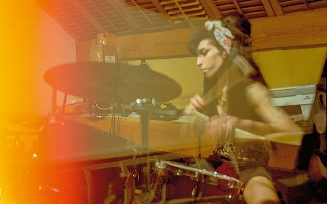 Amy playing drums at her Camden home, 2008. Credit: Blake Wood