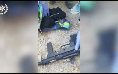 Screenshot from the Israeli police's video, showing the sub-machine guns being uncovered