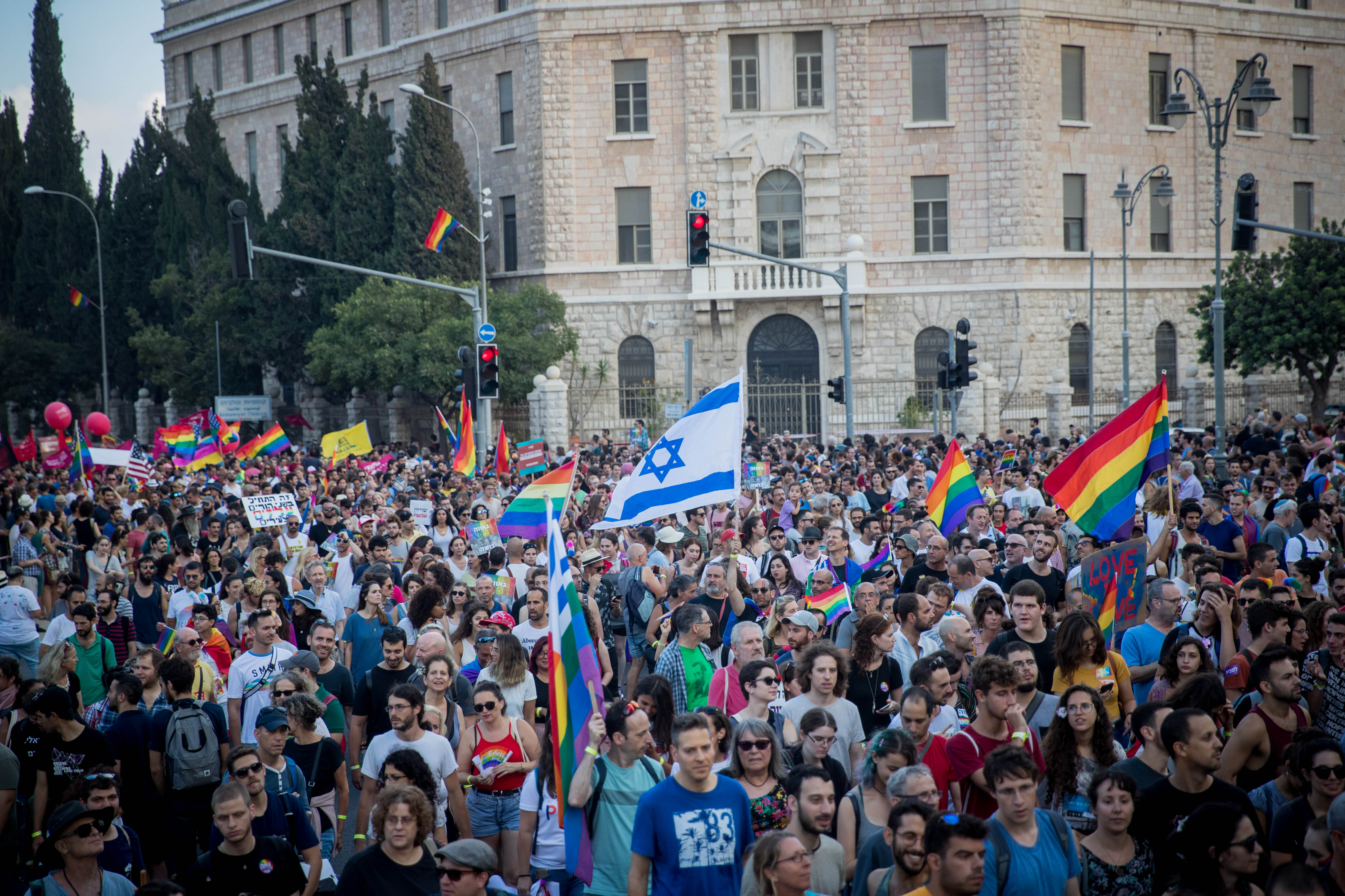 Participants take part in the annual Jerusalem Gay Pride parade on August 2, 2018.   This year's parade, the 17th annual Jerusalem march, is being held under the banner of "Pride and Tolerance". Photo by: JINIPIX