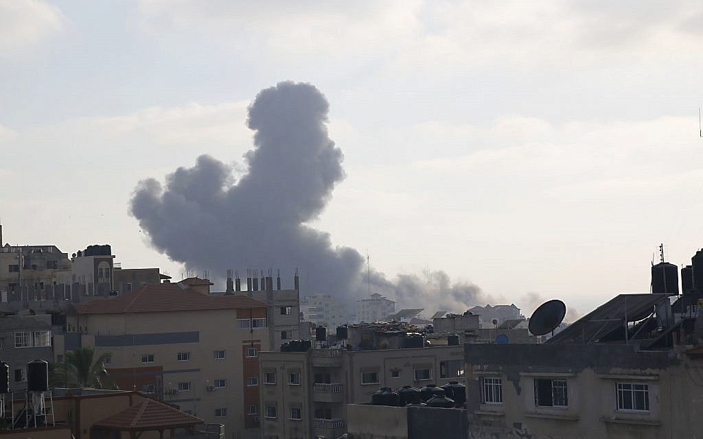 Smoke rises from an explosion caused by an Israeli airstrike in Gaza City, (AP Photo/Hatem Moussa)