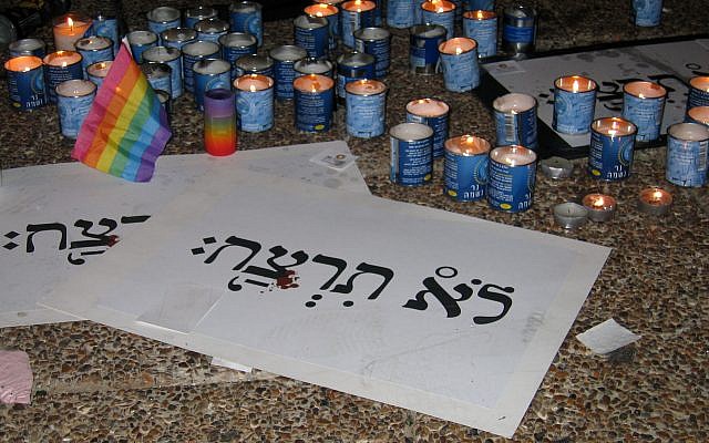 Yahrzeit candles and signs entitled "You shall not murder" at the rally at Rabin Square on 8 August 2009.