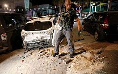 Israeli security cleans up the aftermath of a Palestinian rocket attack (Source: IDF spokesperson)
