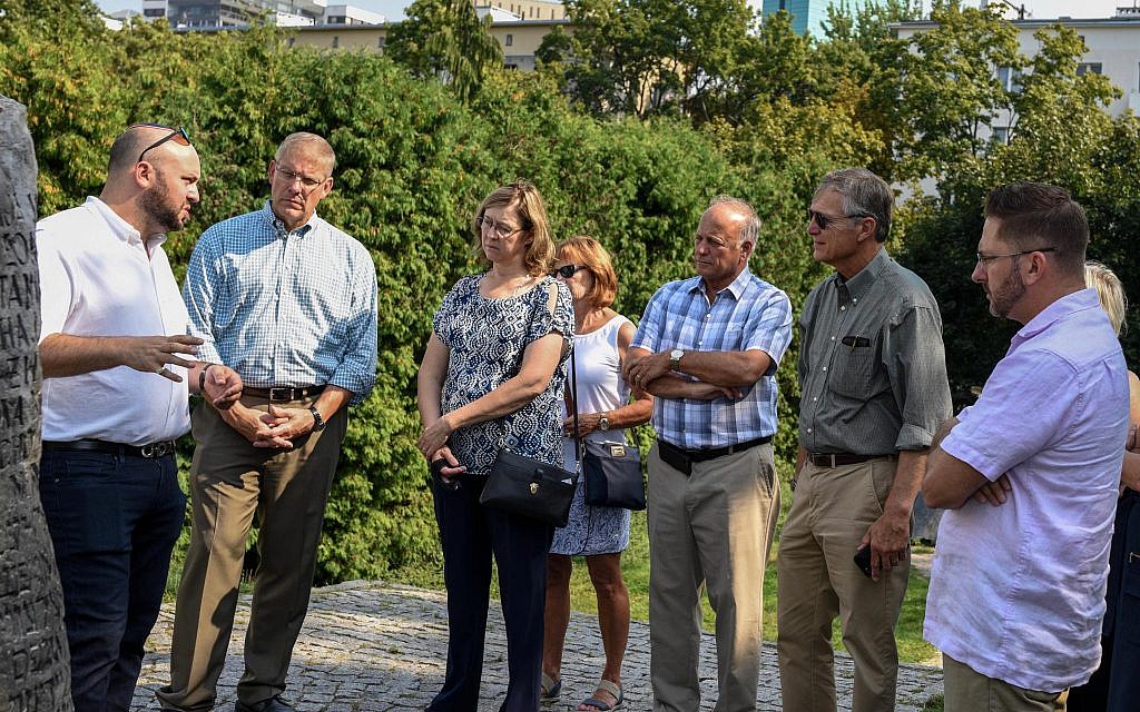 From the Depths Congressional delegation in Poland, including Steve King. Jonny Daniels stands first on the left, speaking to the group.