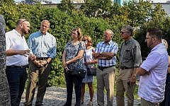 From the Depths Congressional delegation in Poland, including Steve King. Jonny Daniels stands first on the left, speaking to the group.