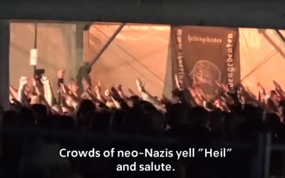 Crowd of neo-Nazis do Hitler salutes and chant 'heil Hitler' at the festival