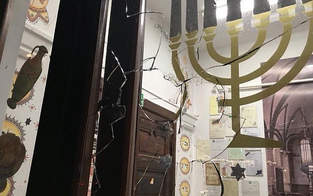 Image of the broken glass after a rock was hurled into the shul .Credit:  Sacha Dratwa on Facebook/ Courtesy GWŻ Gdańsk