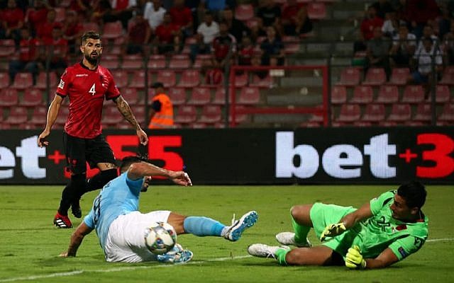 Brighton midfielder Beram Kayal challenges the Albanian goalkeeper during Israel's 1-0 defeat.