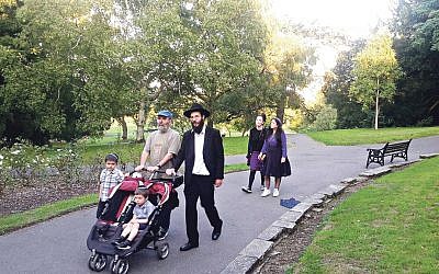 Rabbi Zalmy Blackman, with two of his sons