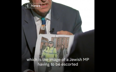 Jeremy Corbyn being confronted with an image of Luciana Berger with a police escort during the conference.