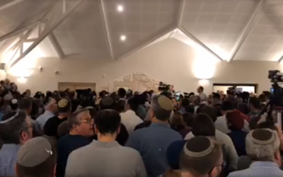 Screenshot from Facebook video of the funeral, attended by thousands