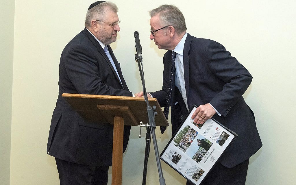 Environment secretary Michael Gove presenting Rabbi Barry Marcus with a framed picture from the Holocaust Educational Trust, thanking him for his work. credit: Graham Chweidan