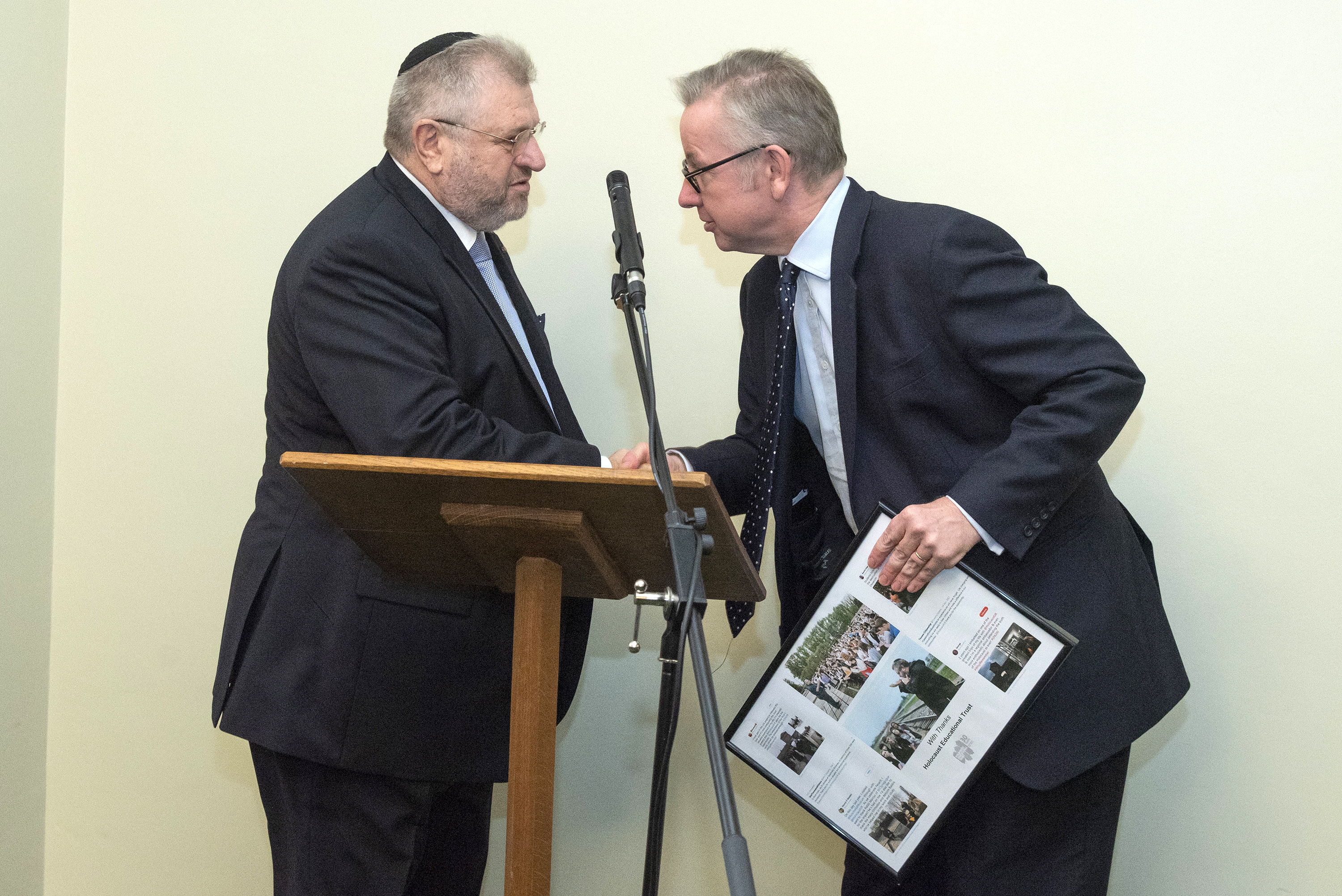 Environment secretary Michael Gove presenting Rabbi Barry Marcus with a framed picture from the Holocaust Educational Trust, thanking him for his work. credit: Graham Chweidan