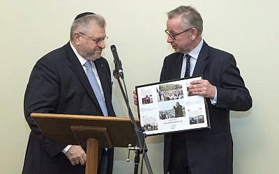 Environment secretary Michael Gove presenting Rabbi Barry Marcus with a framed picture from the Holocaust Educational Trust, thanking him for his work. credit: Graham Chweidan