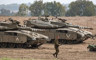 Israeli Merkava tanks are stationed in an open area near Israel's border with the Gaza Strip on October 19, 2018, after Gaza's Islamist rulers Hamas pledged to launch an investigation into rocket fire at Israel earlier this week, in an apparent bid to calm fears of a new war. Photo by: JINIPIX