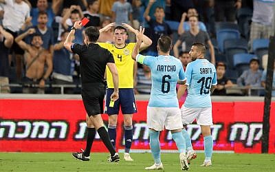 Scotland's Jon Soutattar is shown a red card during the UEFA Nations League Group C1 match at the Sammy Ofer Stadium, Haifa.  Photo credit: Adam Davy/PA Wire.