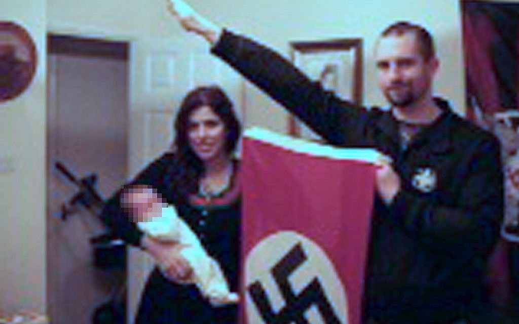 Picture from West Midlands Police shown to jurors at Birmingham Crown Court in October 2018, of Darren Fletcher who has admitted being a member of banned far-right terrorist group National Action, posing with alleged member Claudia Patatas and her baby, at her home in Waltham Gardens, Banbury, Oxfordshire. Photo credit: West Midlands Police/PA Wire