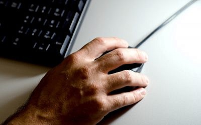 A person using a computer. Photo credit: Adam Peck/PA Wire